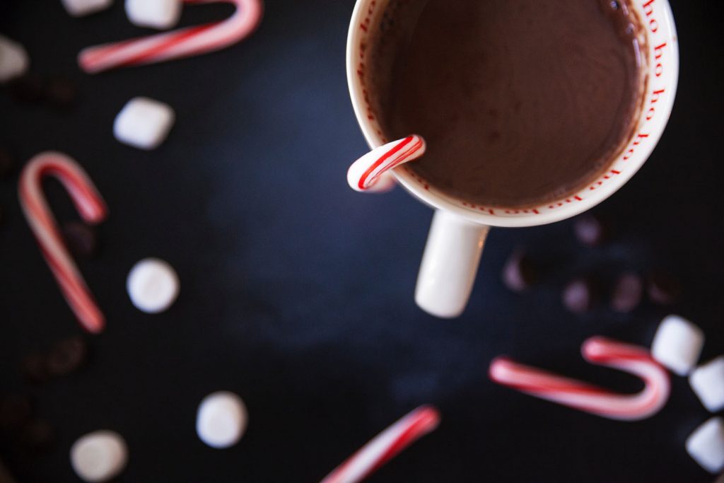 mug of hot chocolate with mini candy canes