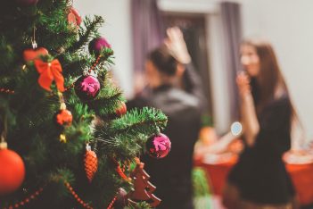 Christmas party with tree in foreground