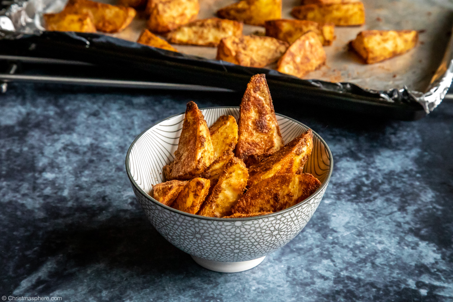 Tray of spiced potato wedges