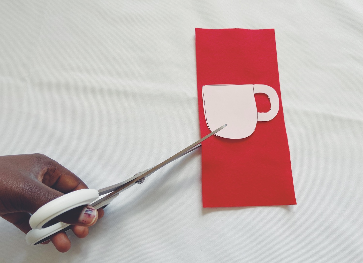 Cutting out the red felt