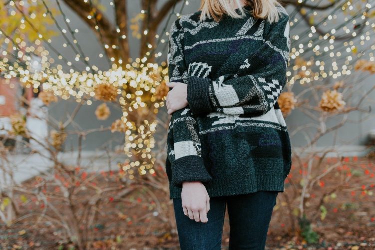 Girl outside in a christmas jumper