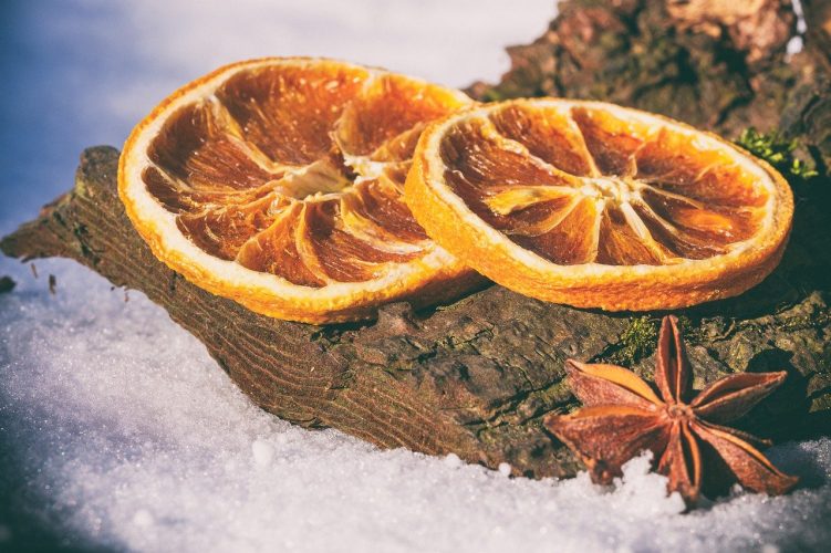 dried orange slices in snow