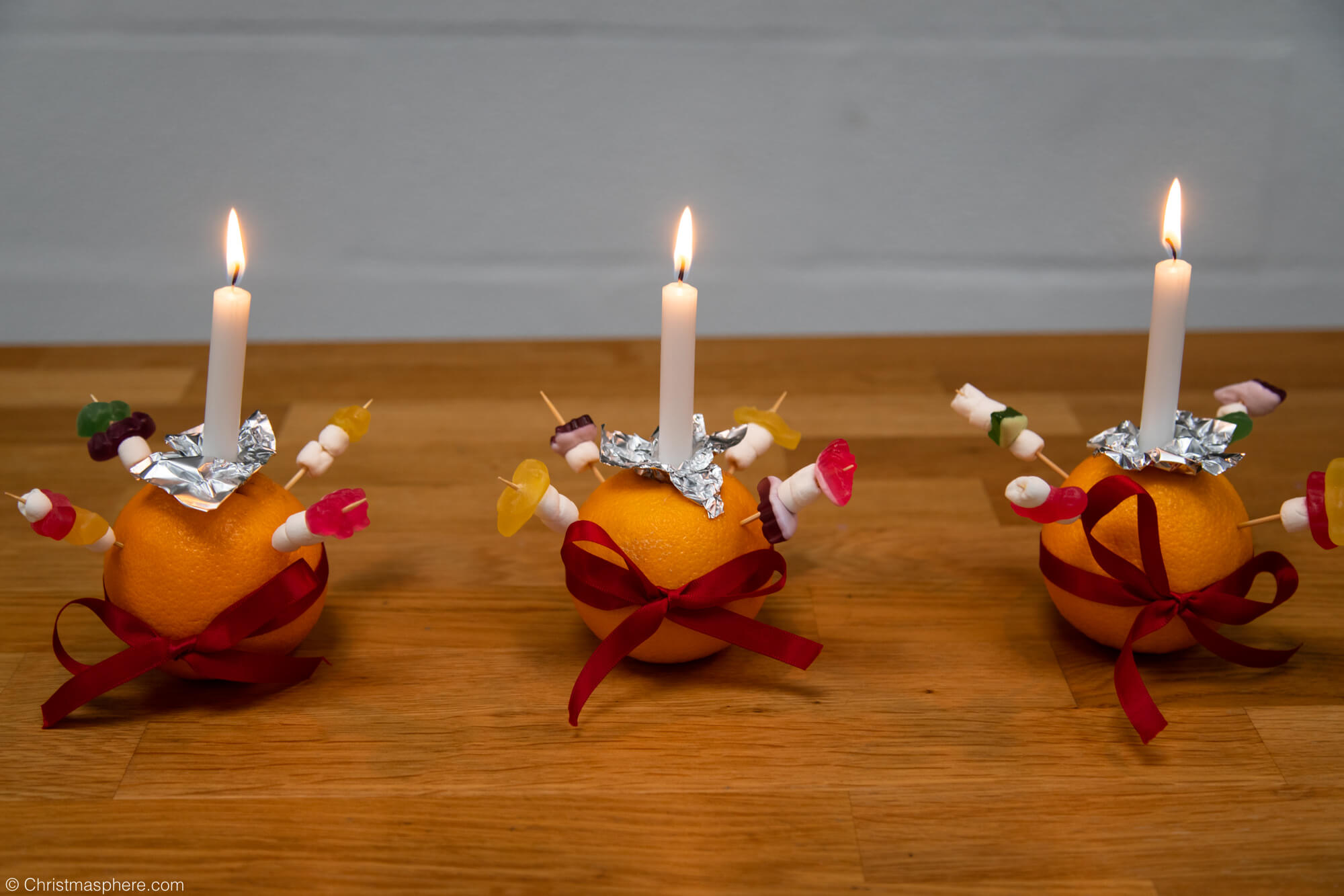 three christingles lit candles