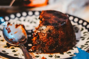 plate of christmas pudding with a serving spoon